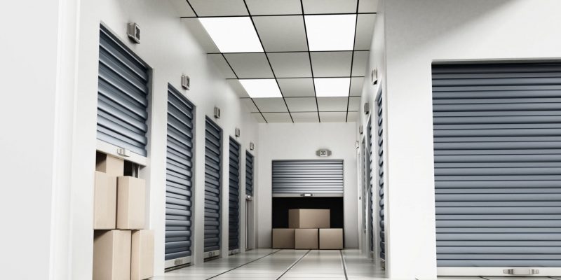 open-self-storage-units-full-cardboard-boxes-among-closed-doors-3d-illustration Open self storage units full of cardboard boxes among closed doors. 3d illustration